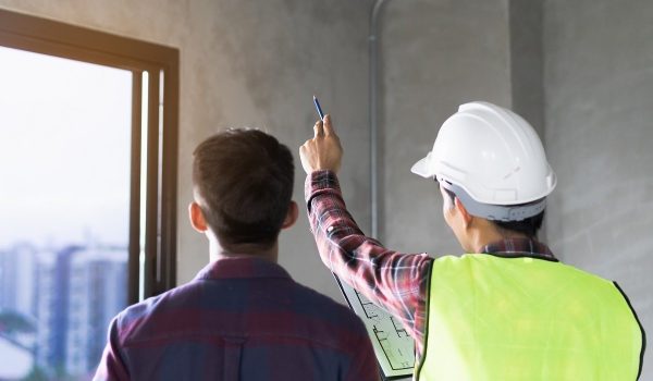 Client and Contractor discussing plan to renovation house.